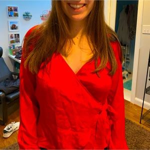 Red silky wrap blouse. Great for the holidays! Never worn.